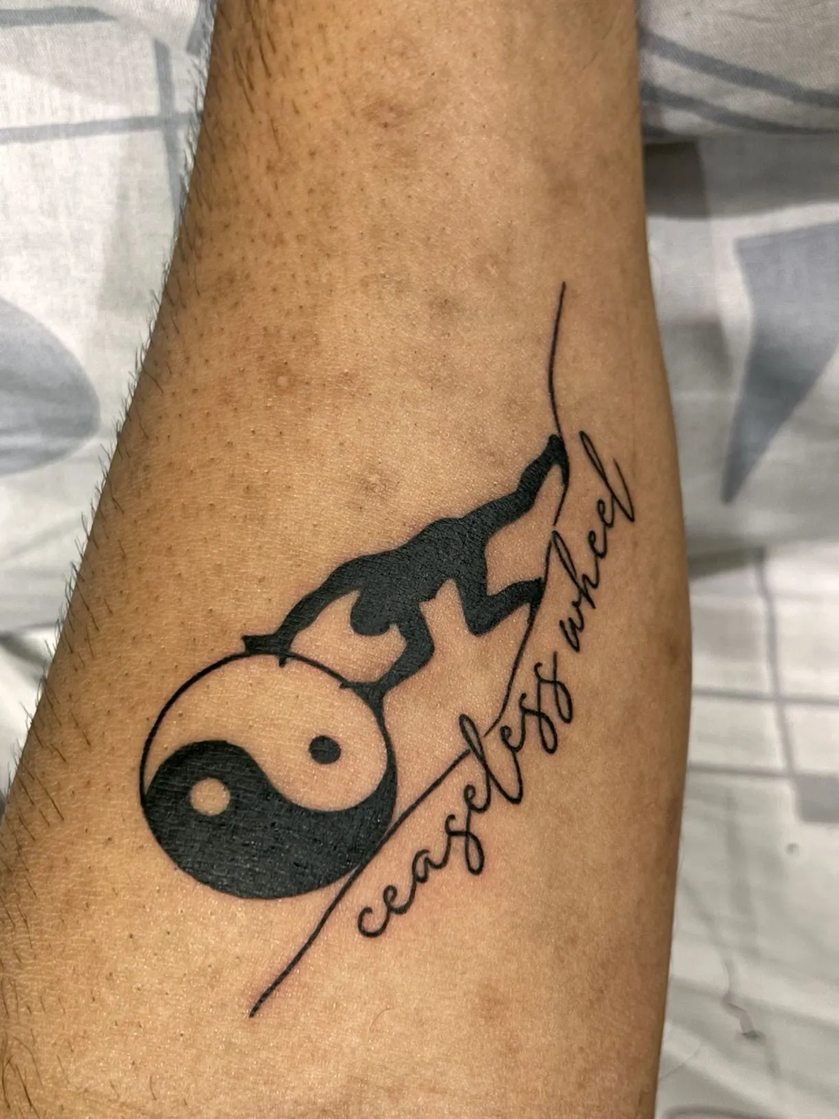 a person with a tattoo on their leg