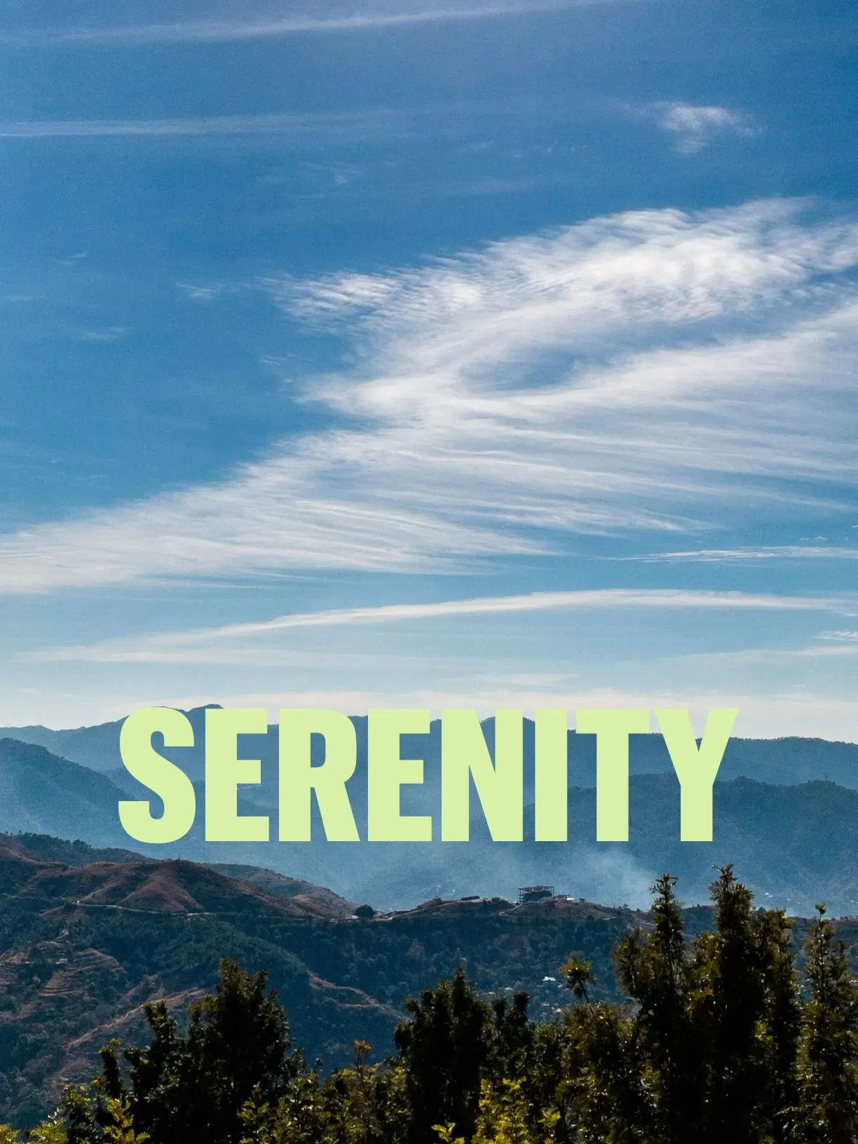 the words serenity are in front of some trees and mountain range with blue sky