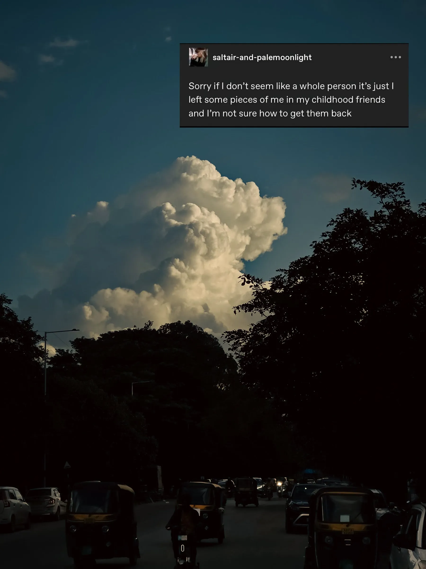 the sky is filled with clouds and cars