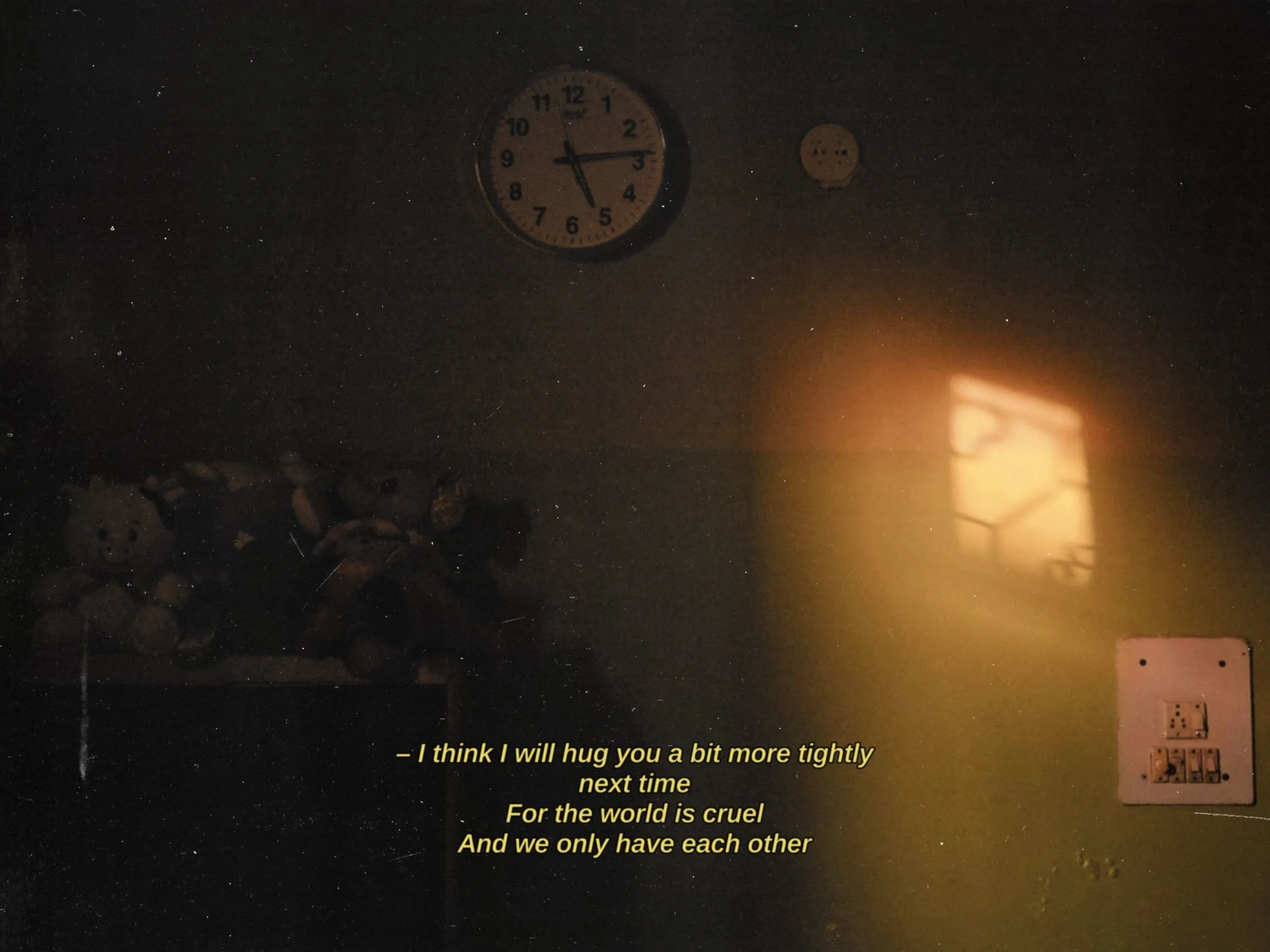 a dark room with a clock on the wall and a poem written in front of it